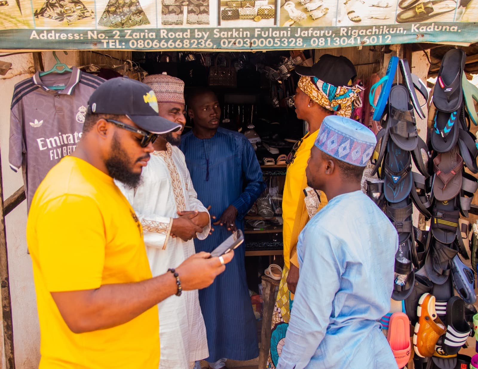 Agents onboarding a market trader at his stall