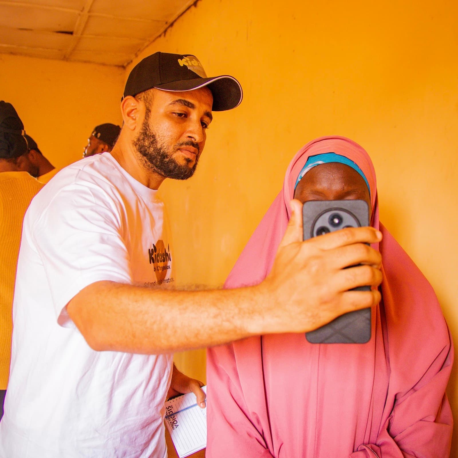 An agent capturing a member's details during onboarding