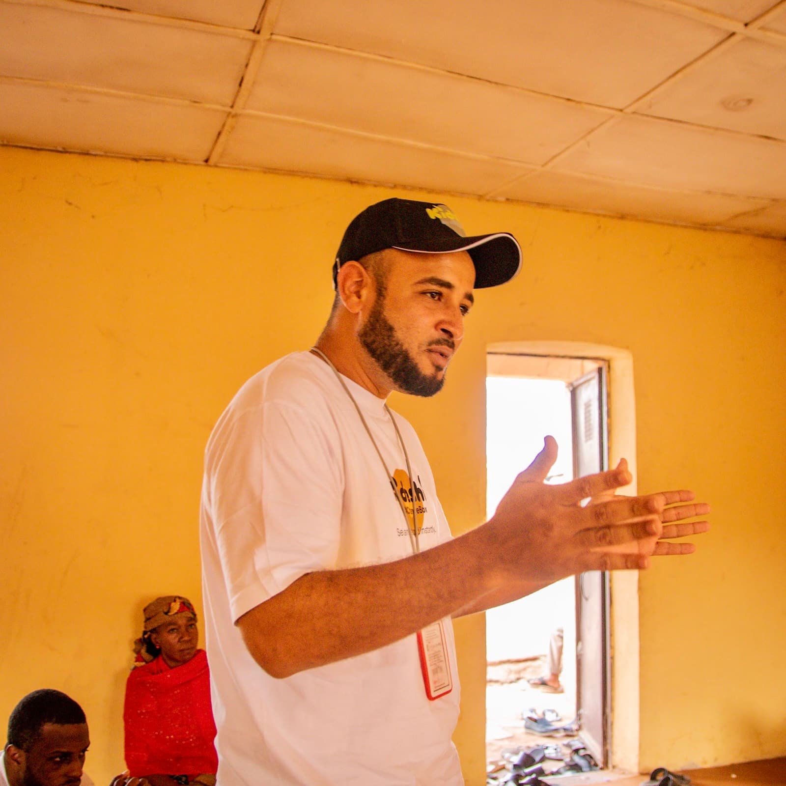 A Kidashi team member speaking to the community